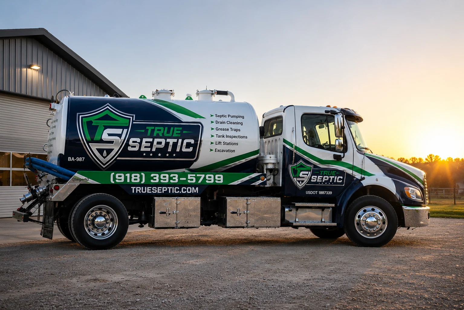 True Septic pump truck with full brand wrap photographed at sunset.