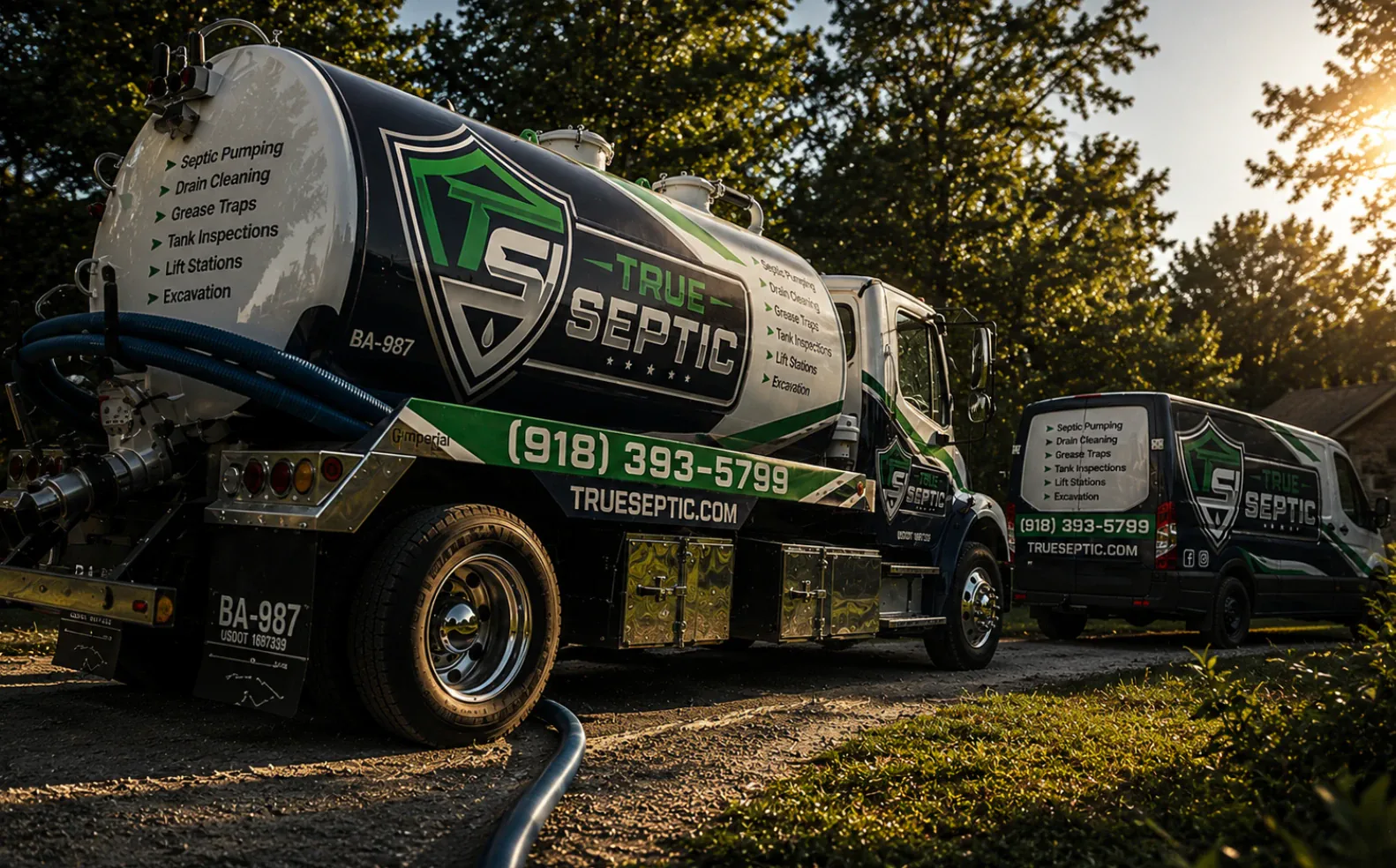 True Septic septic pumping truck and service van fleet with full brand wrap at a residential jobsite.